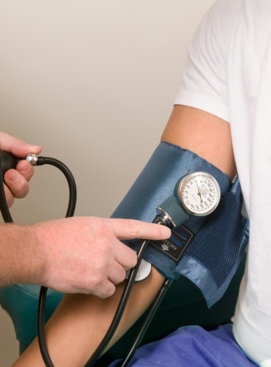 a doctor checking the blood pressure of a patient